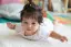 Asian baby girl lying on floor-placeholder