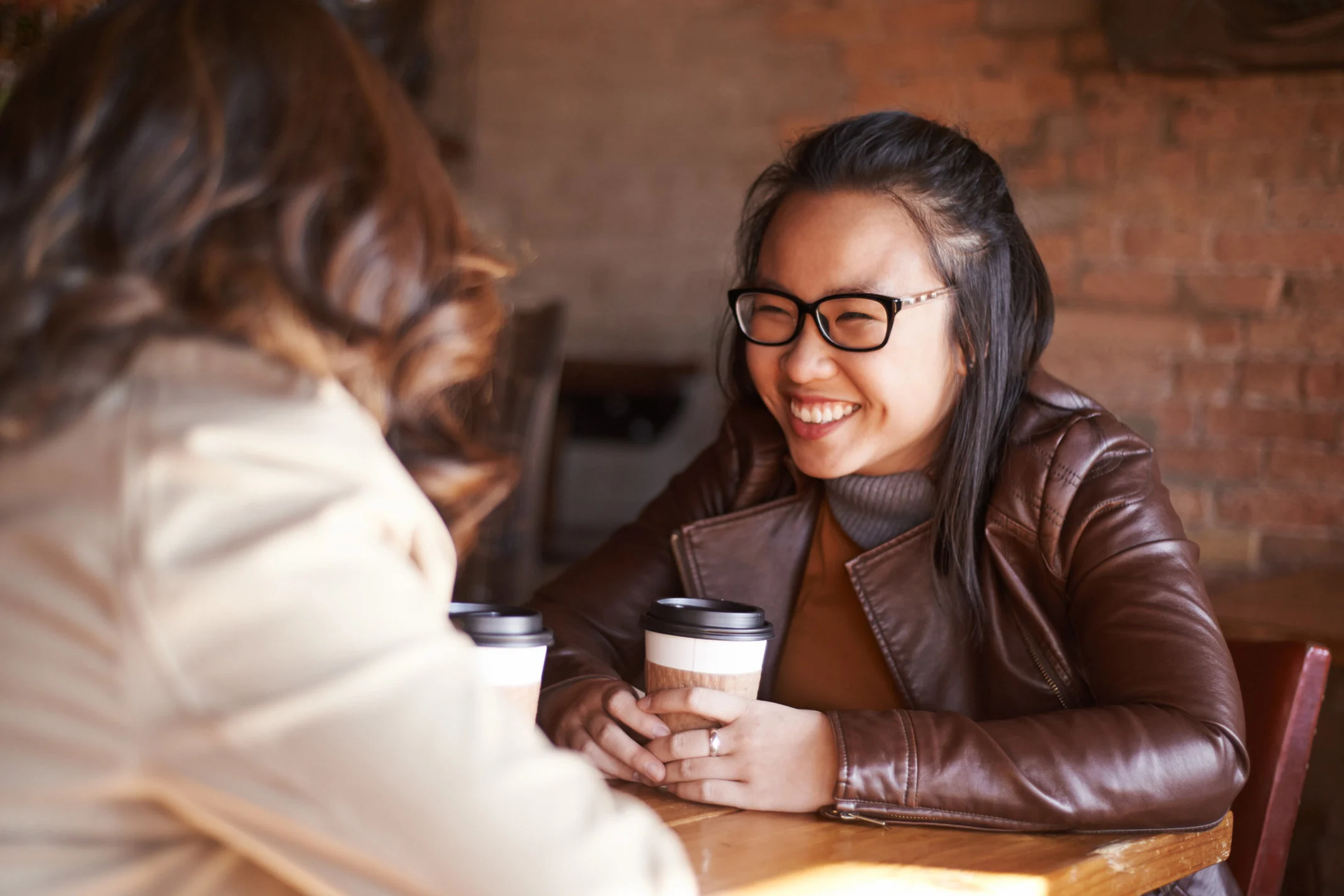 female friends talking over coffee