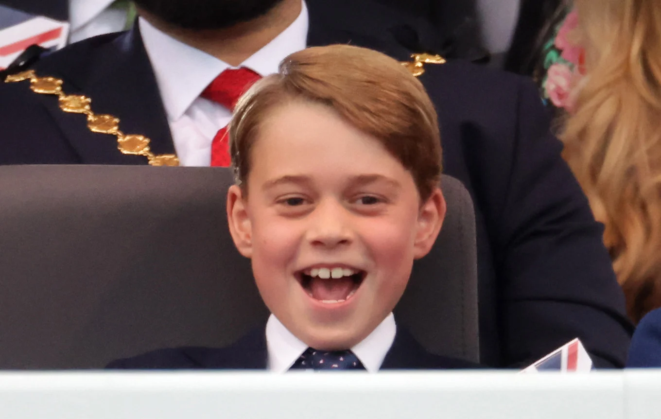 Prince George smiling in a crowd