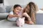 mom and son with piggy bank-placeholder