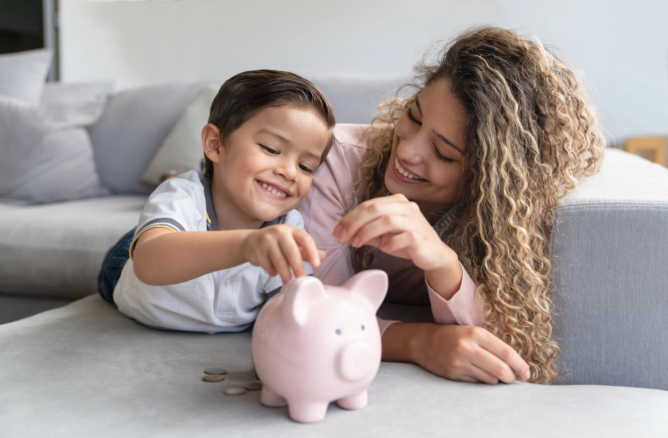 mom and son with piggy bank