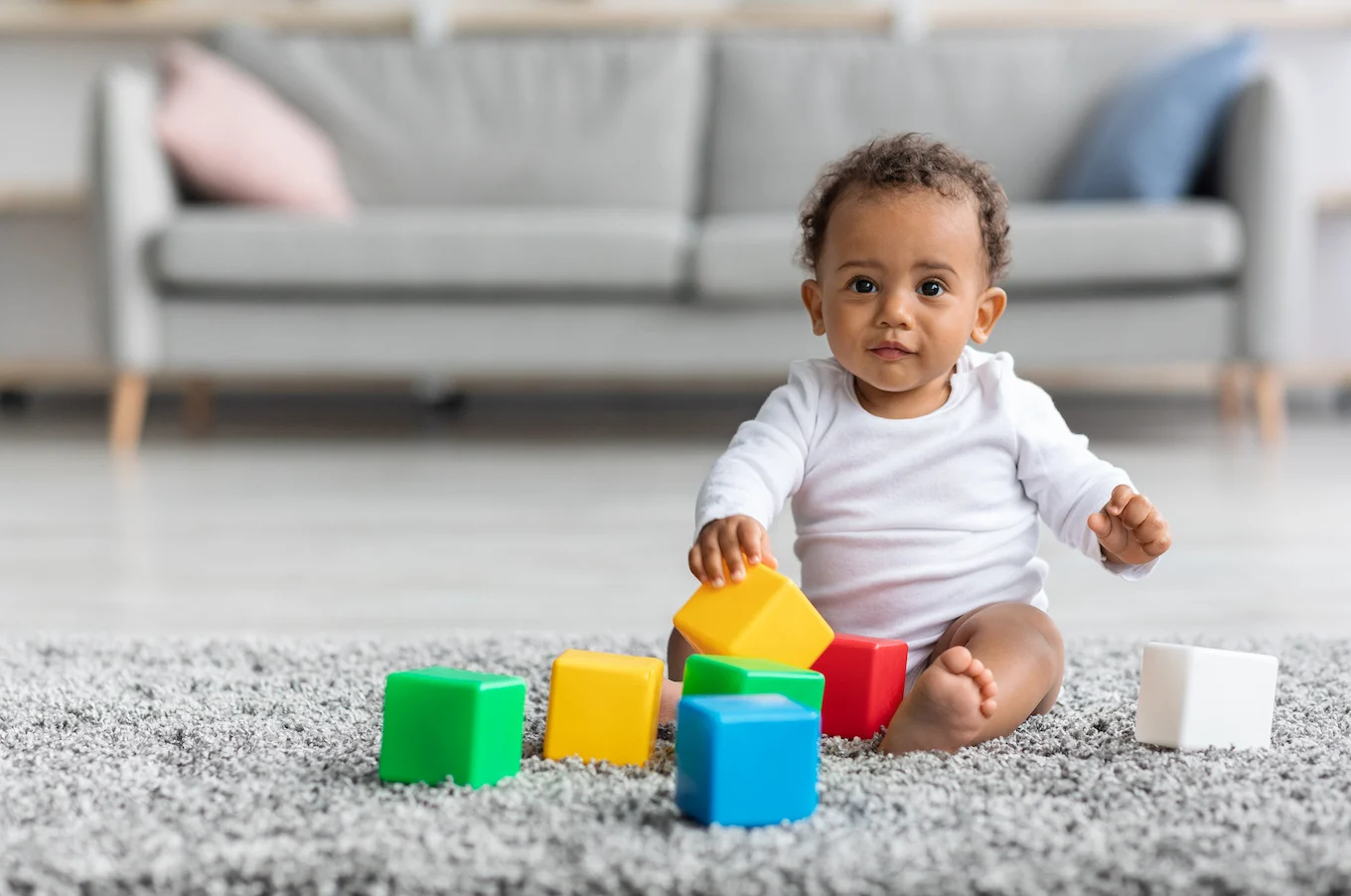 baby boy playing with blocks