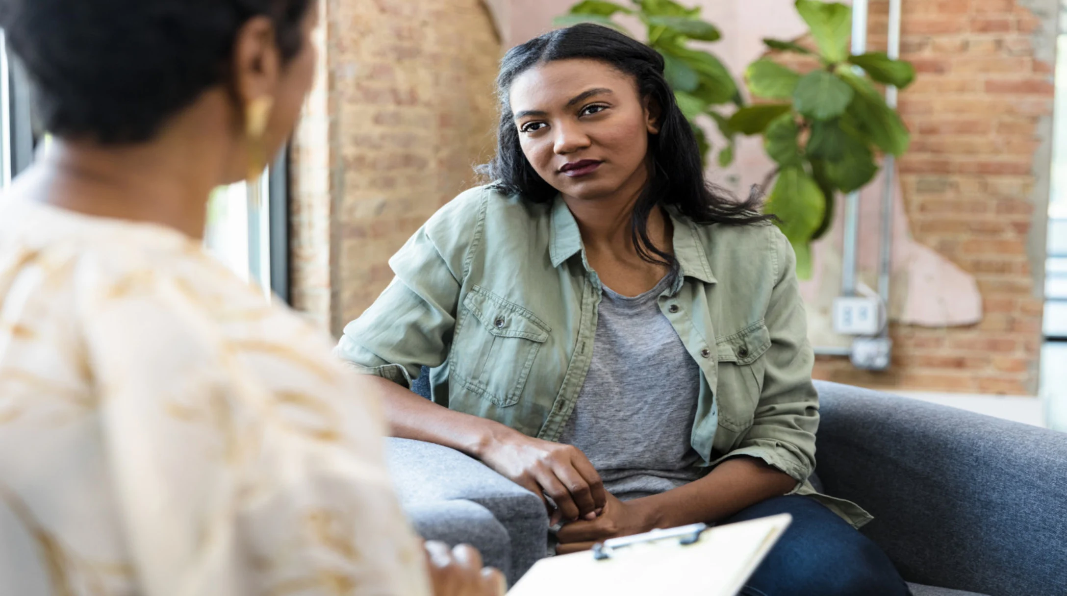 woman speaking with a therapist