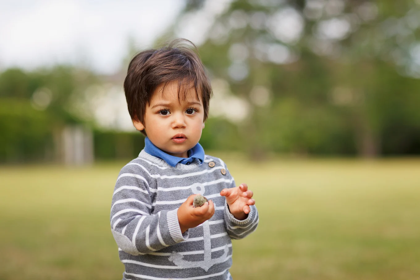 baby boy standing outside