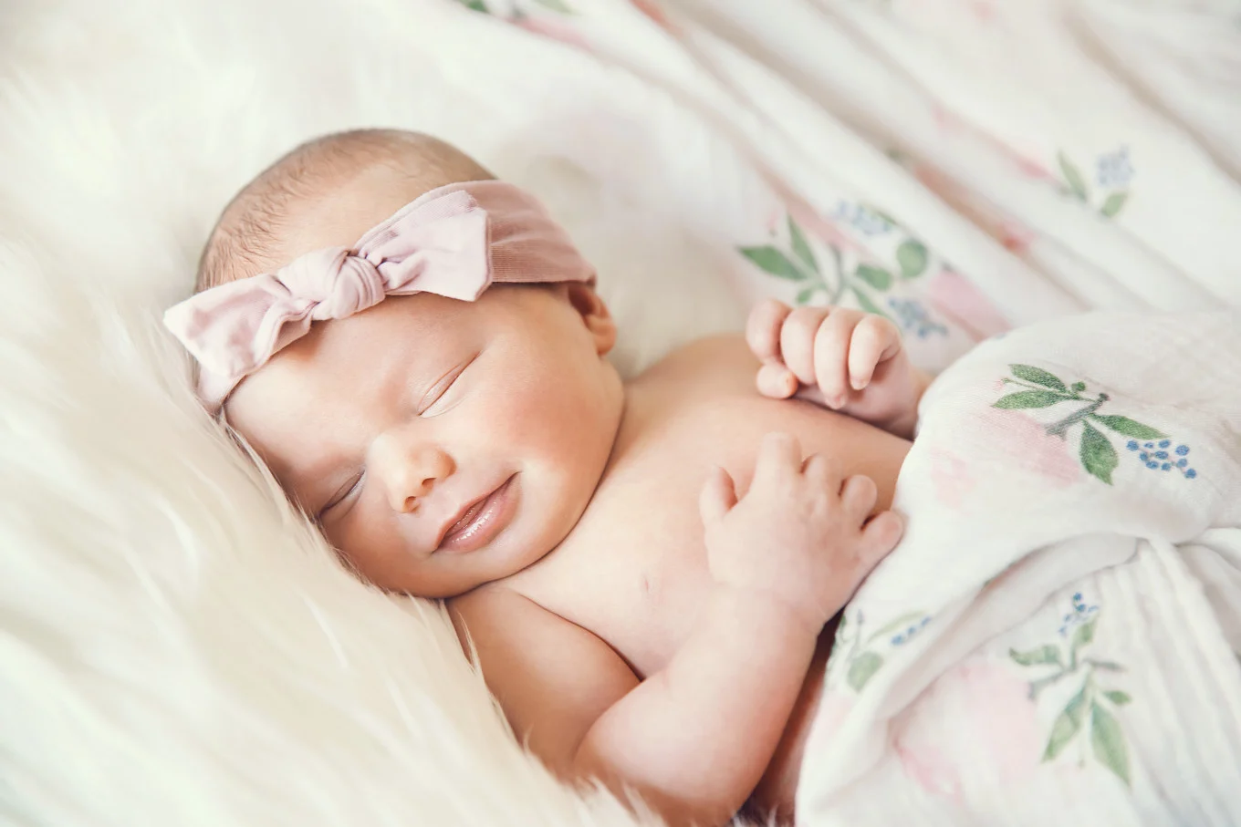 smiling sleeping baby girl