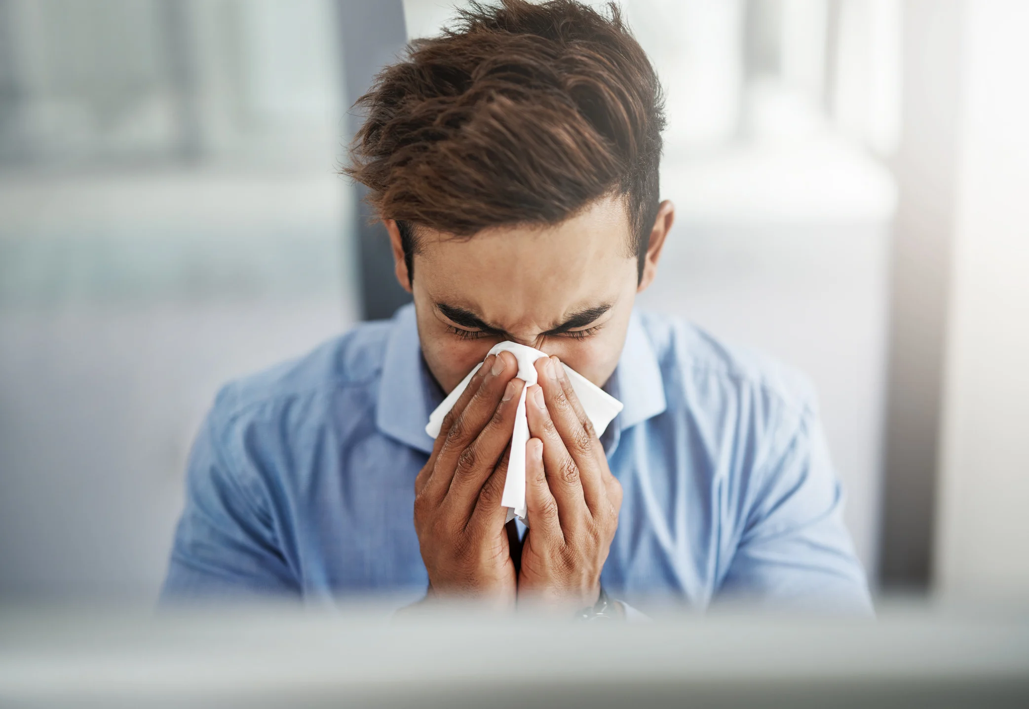 man sneezing